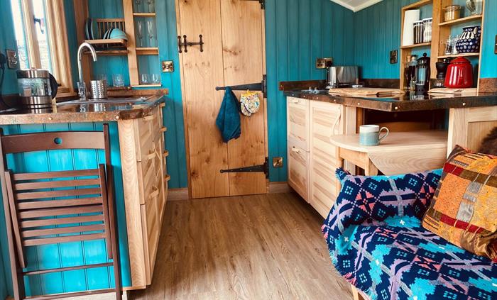 Well equipped kitchen with fridge, 2 ring gas hob, tea, ground coffee, oils and welcome supplies.